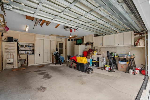 garage with white fridge