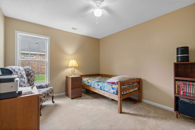 bedroom featuring ceiling fan and light colored carpet