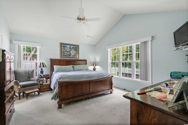 carpeted bedroom with high vaulted ceiling and ceiling fan