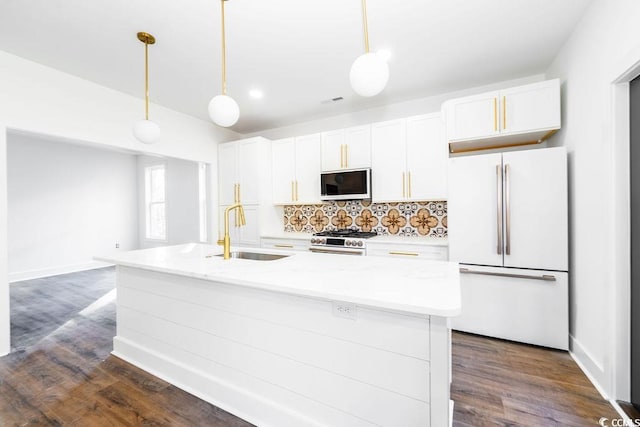 216 Brown Pelican Loop, Pawleys Island, SC 29585 - kitchen featuring freestanding refrigerator, stainless steel gas range oven, a sink, white cabinetry, and backsplash