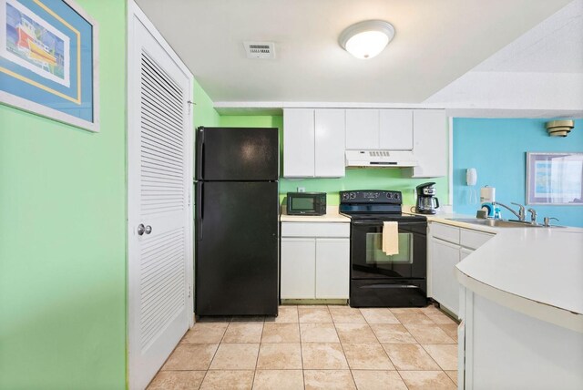 kitchen featuring visible vents, black appliances, under cabinet range hood, white cabinetry, and a sink