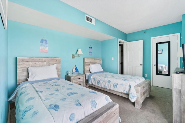 carpeted bedroom with visible vents