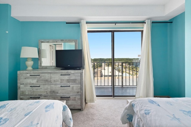 carpeted bedroom featuring access to exterior