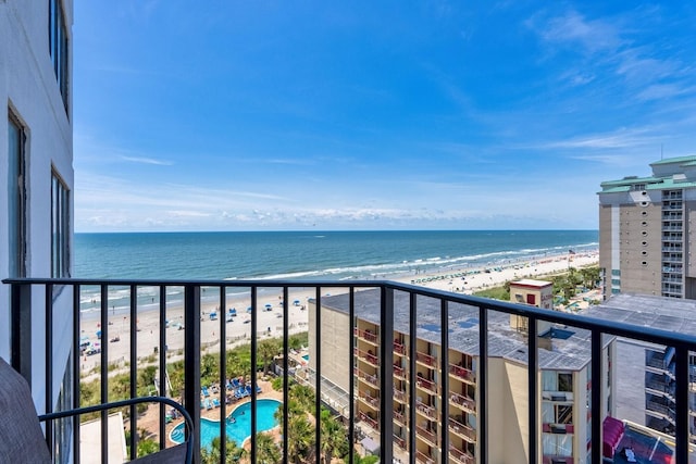 balcony with a view of the beach and a water view