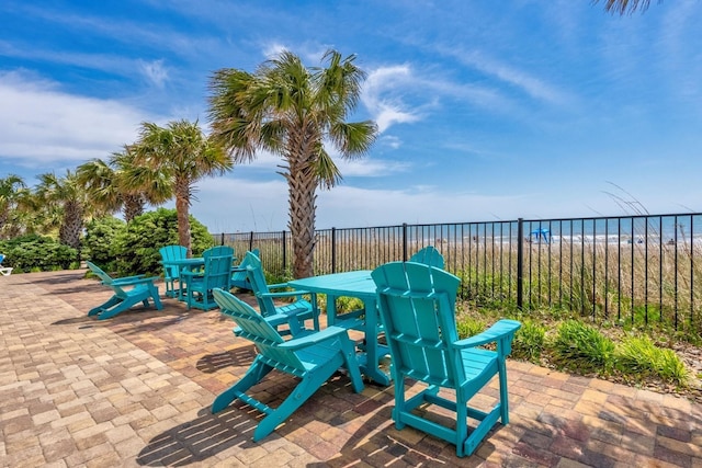 view of patio / terrace with outdoor dining space and fence