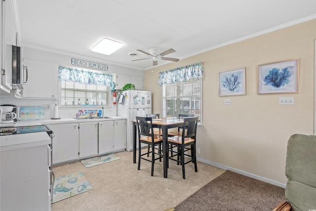 kitchen with white cabinetry, white fridge, light tile patterned floors, ceiling fan, and electric range oven