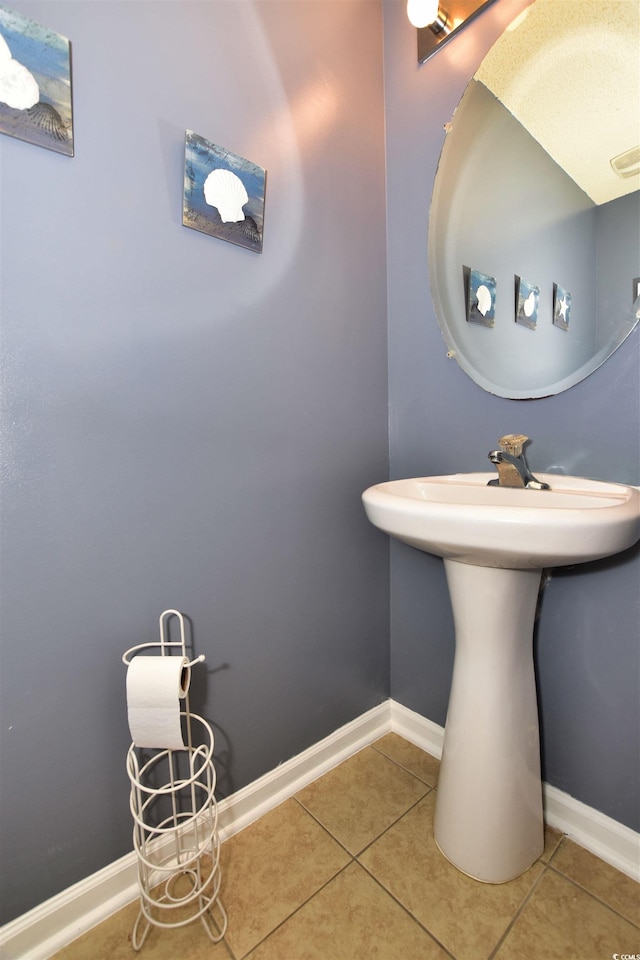 bathroom with tile patterned floors