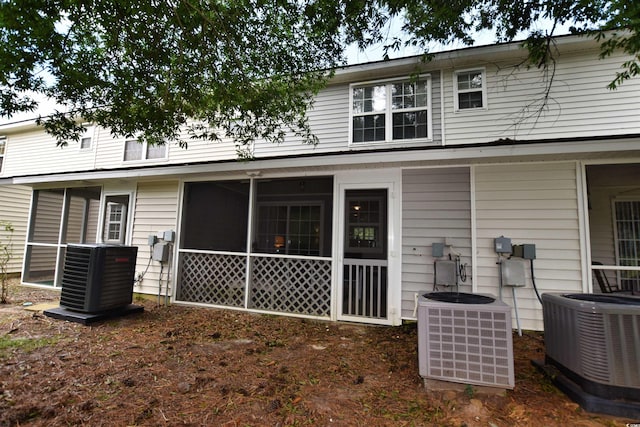 rear view of property featuring central AC