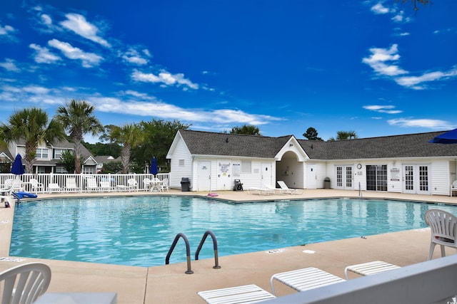 view of swimming pool featuring a patio area