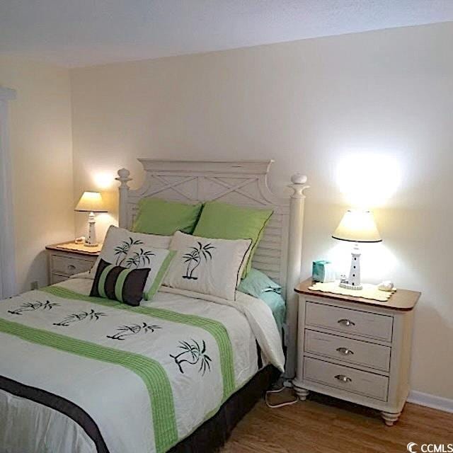 bedroom featuring wood-type flooring