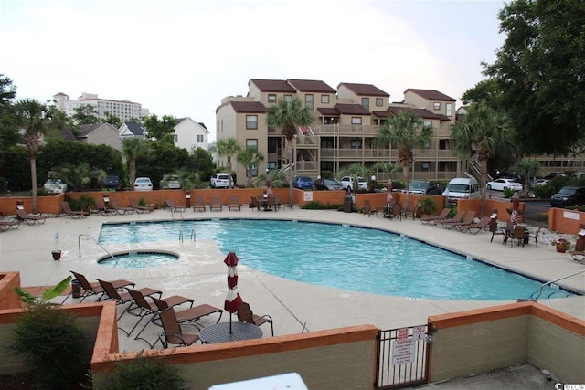 view of swimming pool with a patio area