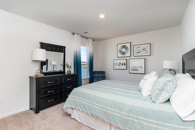 bedroom featuring light colored carpet