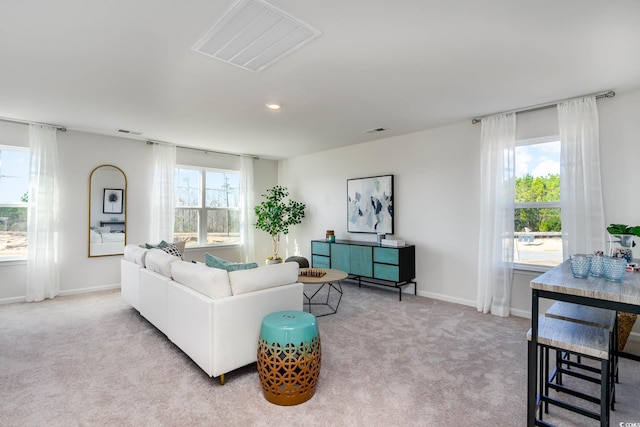 living room featuring light colored carpet