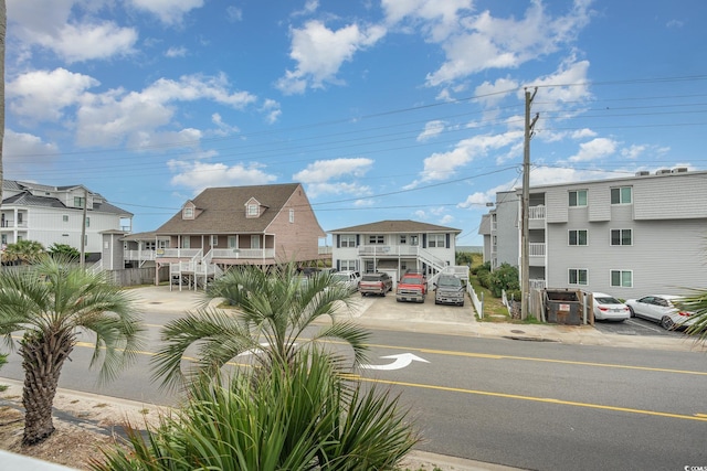 view of road featuring a residential view, curbs, and sidewalks