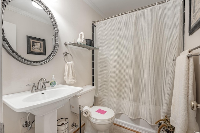 bathroom with shower / bath combo, toilet, and crown molding