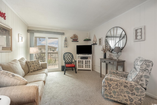 carpeted living area with baseboards and ornamental molding