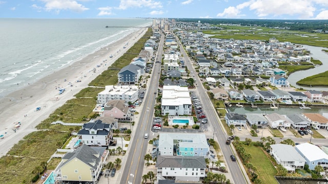 bird's eye view featuring a water view, a residential view, and a beach view