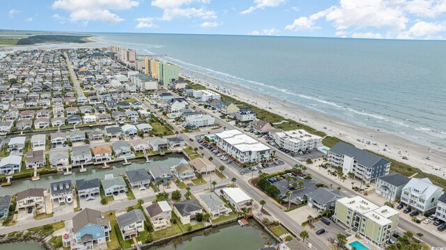 bird's eye view with a beach view and a water view