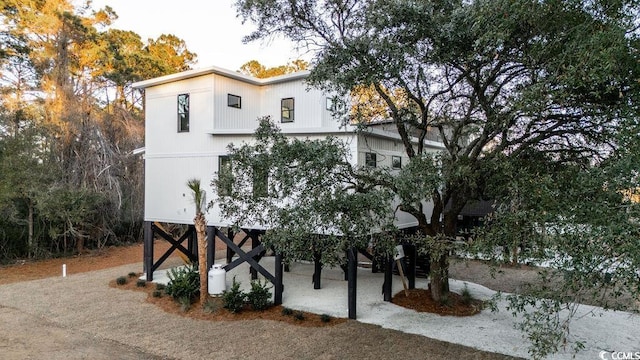 view of front of house with driveway and stairs