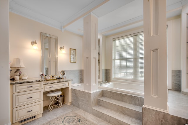 bathroom with tile patterned floors, vanity, crown molding, and tiled bath