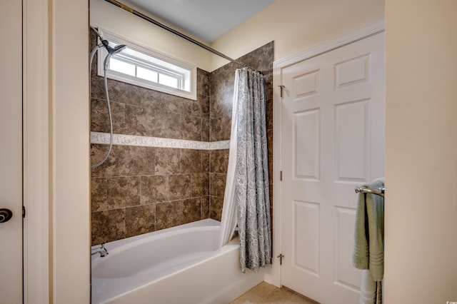 bathroom featuring tile patterned flooring and shower / bath combo