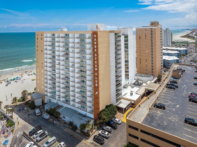 aerial view with a water view and a view of the beach