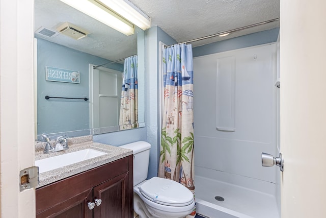 bathroom featuring a textured ceiling, toilet, vanity, and a shower with shower curtain