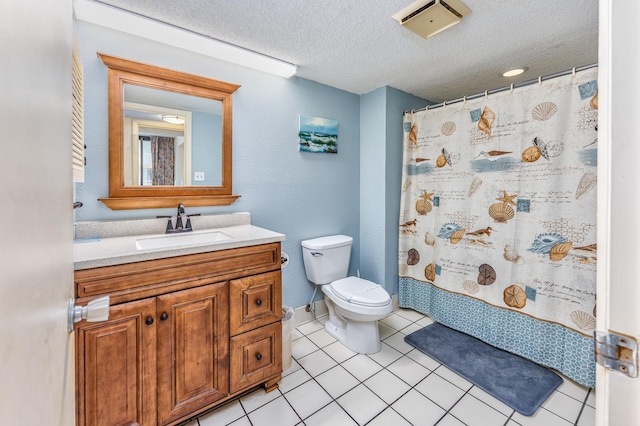 bathroom featuring toilet, a shower with curtain, a textured ceiling, tile patterned floors, and vanity