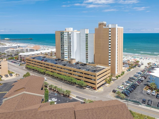 aerial view with a beach view and a water view