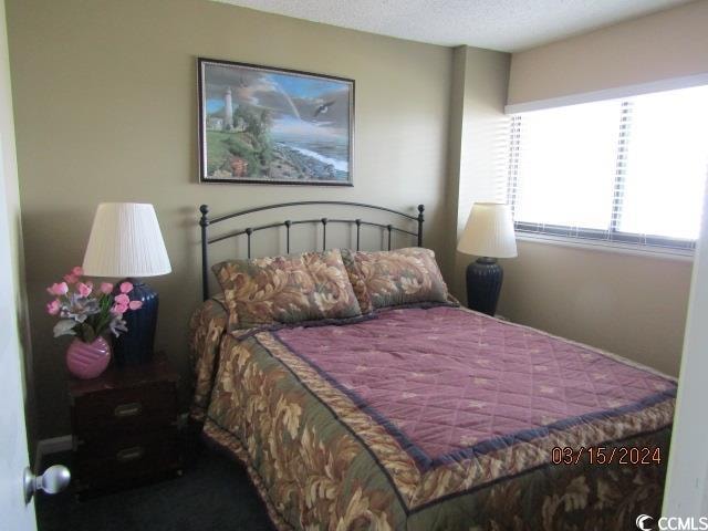 bedroom featuring a textured ceiling