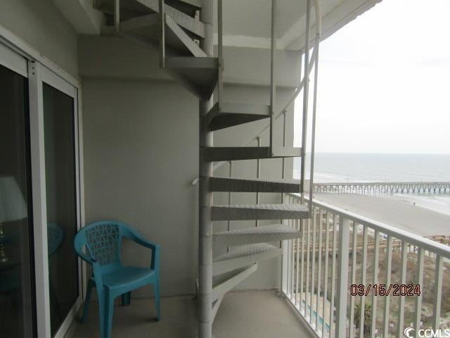 balcony featuring a water view