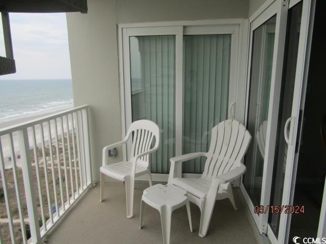 balcony featuring a water view