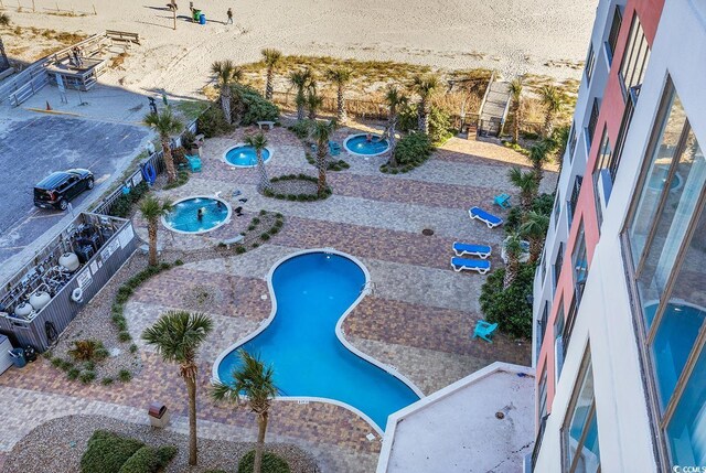 view of swimming pool featuring a patio area