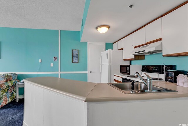 kitchen featuring range, white cabinets, sink, carpet floors, and kitchen peninsula