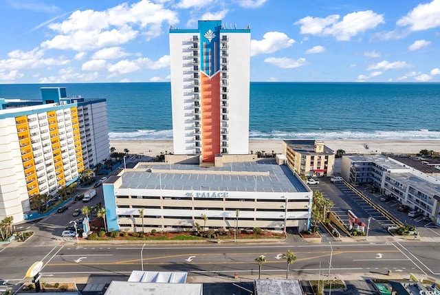 birds eye view of property with a view of the beach and a water view