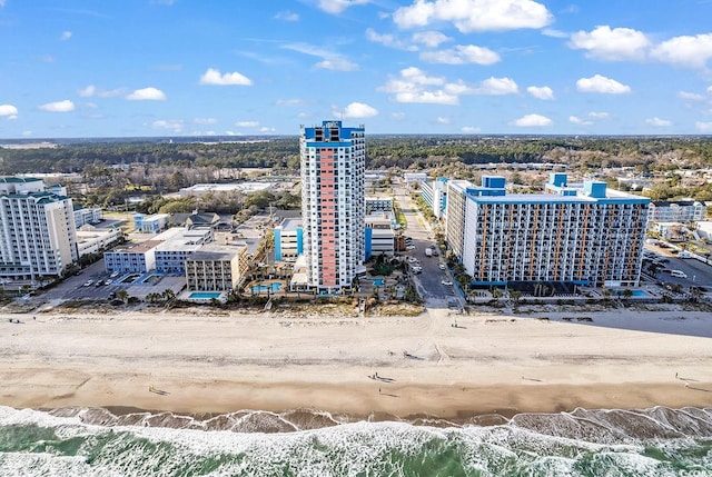 bird's eye view featuring a beach view and a water view