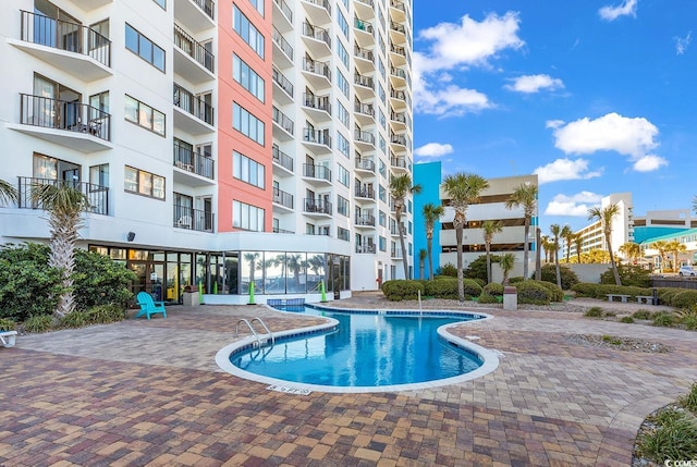 view of swimming pool with a patio