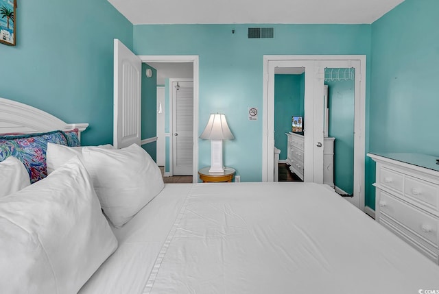 bedroom featuring visible vents and a closet