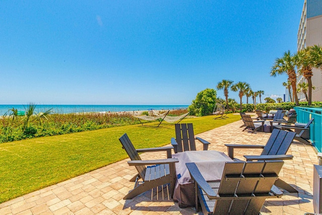 view of patio featuring a water view