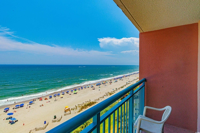 balcony with a beach view and a water view