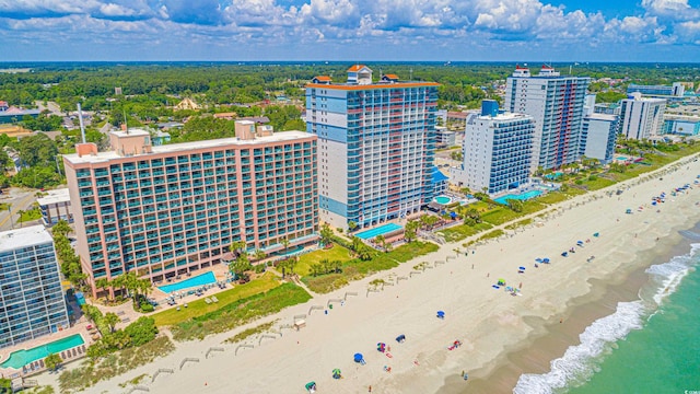 bird's eye view featuring a water view and a view of the beach