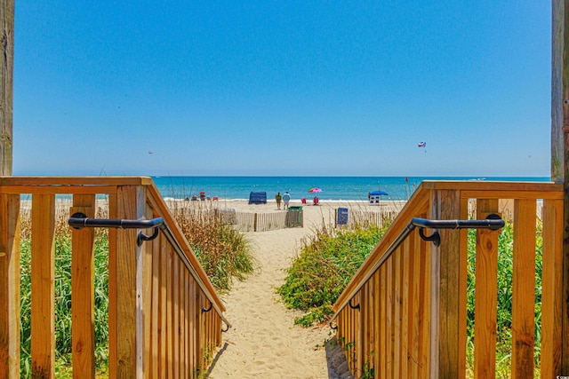 property view of water featuring a beach view