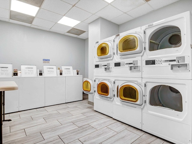 laundry room with separate washer and dryer and stacked washer / drying machine