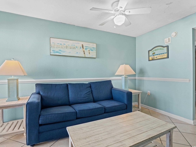 tiled living room with ceiling fan