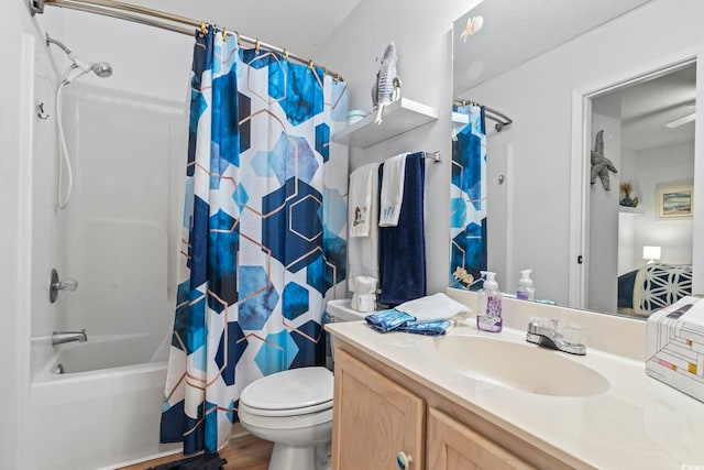 full bathroom with vanity, toilet, hardwood / wood-style flooring, and shower / bath combo