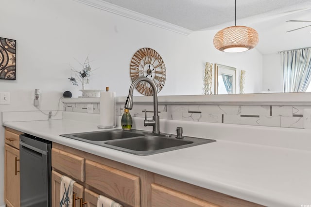 kitchen with dishwasher, ornamental molding, decorative light fixtures, and sink