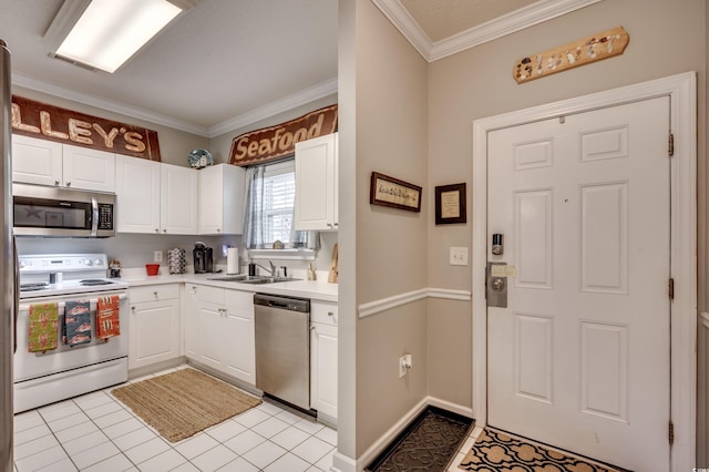 kitchen with white cabinetry, appliances with stainless steel finishes, sink, and light tile patterned floors