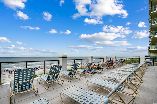 view of patio with a water view