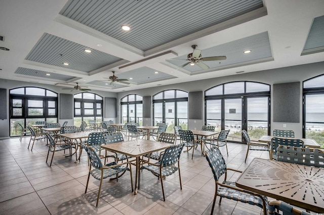 interior space featuring ornamental molding, coffered ceiling, beam ceiling, and light tile patterned floors