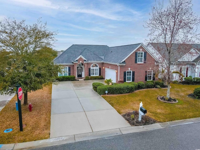 view of front of home featuring a garage and a front yard